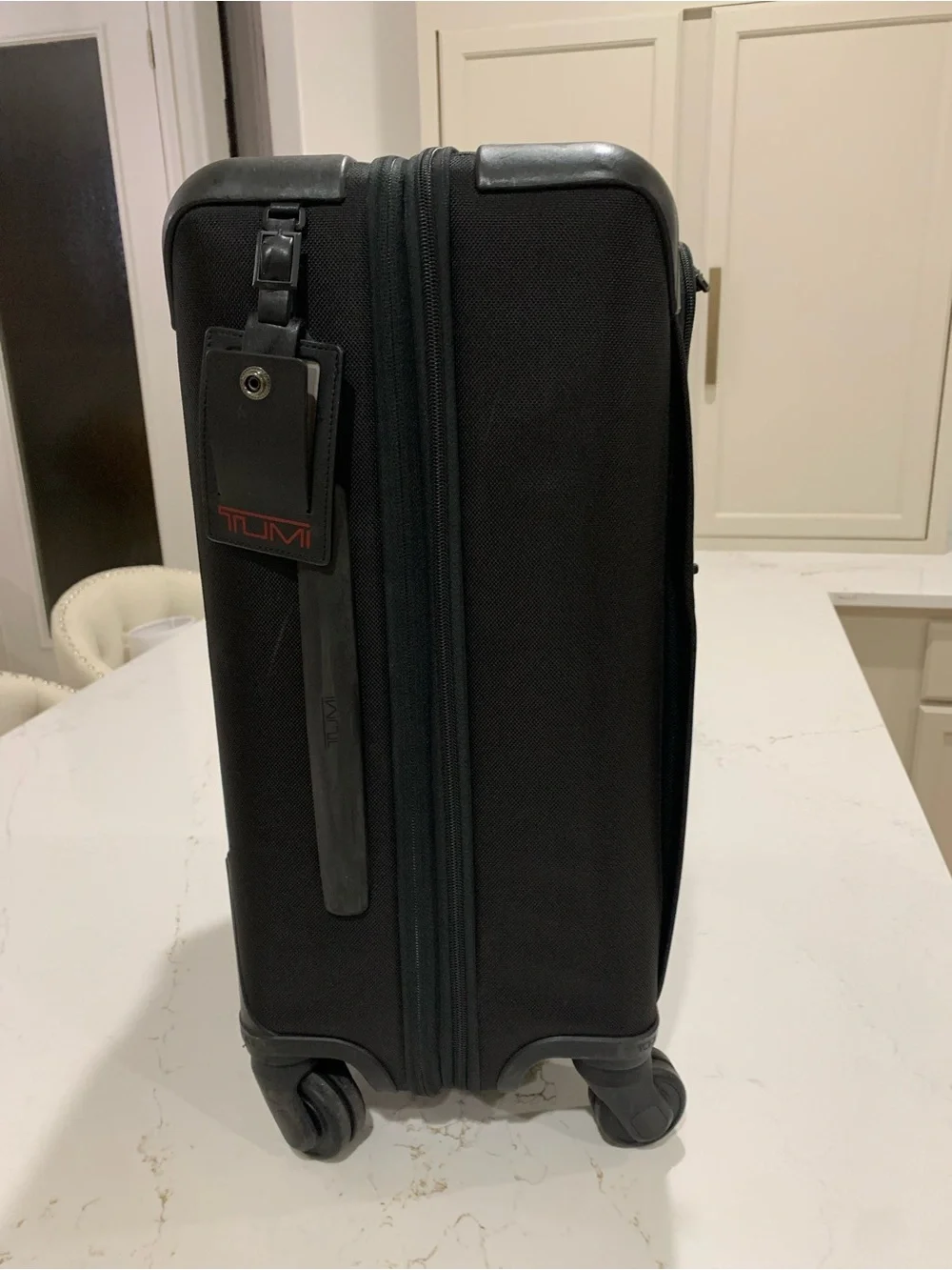 Tumi Black Spinner Carry-On with Front Zip Pocket luggage